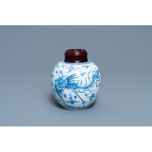 A Chinese blue and white 'dragon and phoenix' jar with woode...