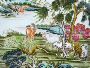 A Chinese porcelain charger, hand painted enamel horses in l...