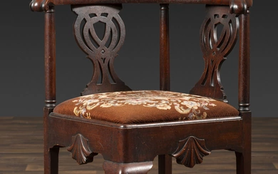 A Chippendale Shell-Carved Mahogany Knuckle-Arm Claw-and-Ball Foot Corner Chair