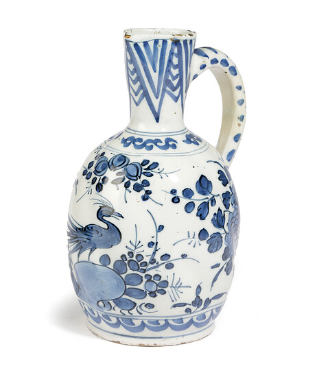 A DELFT POTTERY BLUE AND WHITE JUG OR EWER