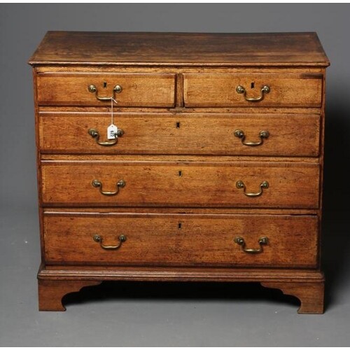 A GEORGIAN OAK AND MAHOGANY BANDED STRAIGHT FRONTED CHEST, l...