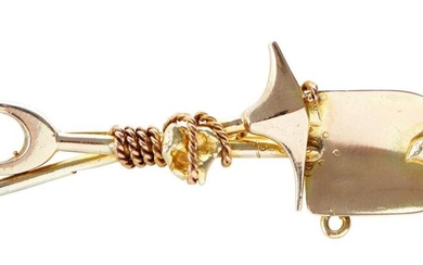 A GOLD MINERS BROOCH