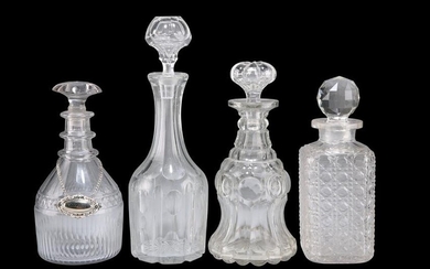 A GROUP OF FOUR GEORGIAN AND LATER GLASS DECANTERS, one