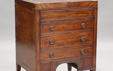 A George III mahogany dressing table, the double hinged top revealing a compartmentalized interior a