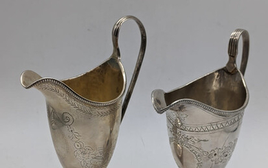 A George III silver cream jug, etched decor, vacant...