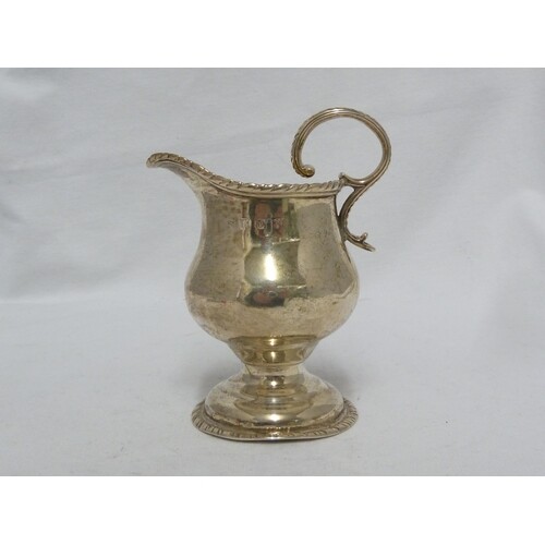 A George III silver cream jug, of squat baluster form with g...