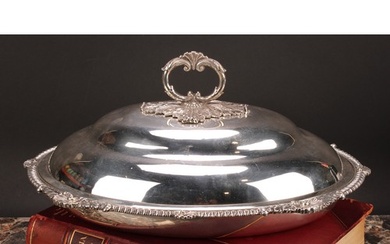 A George III silver oval vegetable dish, ogee cover with lea...