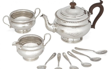 A George V silver three-piece tea set, Birmingham, c.1926, Mappin & Webb, comprising teapot, sugar and jug (jug not shown in photo, further images available upon request), each of rounded form with gadrooned rim, the teapot with wooden handle and...