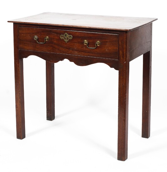 A Georgian mahogany side table, with frieze drawer and scroll apron, on chamfered square legs