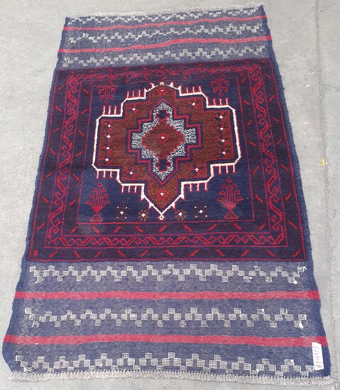A HAND KNOTTED PURE WOOL PERSIAN BALUCHI