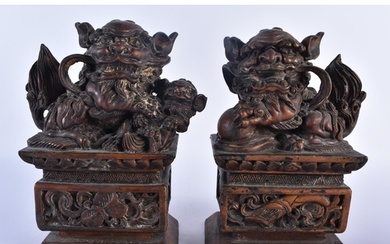 A PAIR OF LATE 19TH CENTURY CHINESE CARVED WOOD FIGURES OF B...