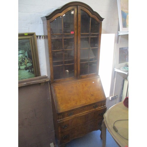 A Queen Anne style walnut veneered bureau bookcase, two door...