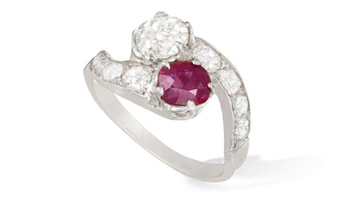 A RUBY AND DIAMOND DRESS RING Of crossover...