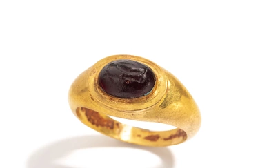 A Roman Gold and Garnet Finger Ring with the Goddess Fortuna