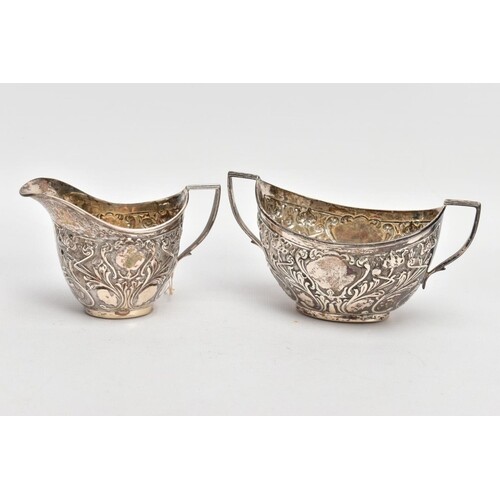 A SILVER CREAMER AND MATCHING SUGAR BOWL, the creamer emboss...