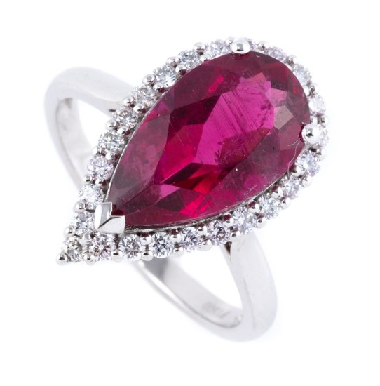 A TOURMALINE AND DIAMOND RING; set in platinum with a pear cut rubellite (pink tourmaline) of approx. 4.10ct surrounded by 24 round...