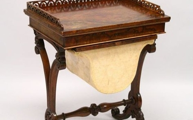A VICTORIAN WALNUT WORK TABLE, with galleried top over