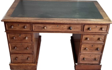 A Victorian mahogany pedestal desk with black leather insert top,...