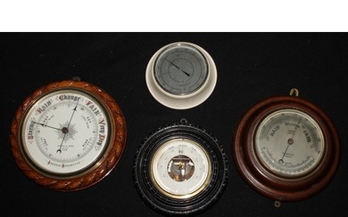 A Victorian oak circular aneroid barometer, 20cm register in...