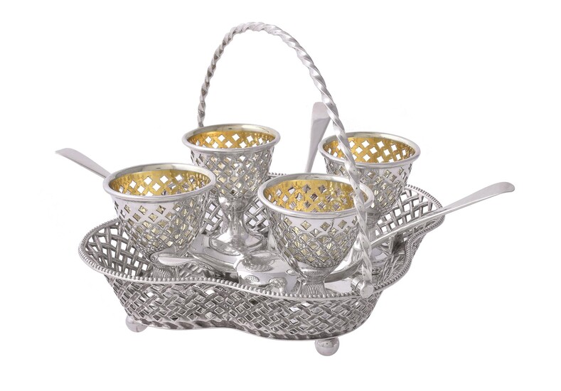 A Victorian silver quatrefoil four cup egg stand by Henry Wilkinson & Co.