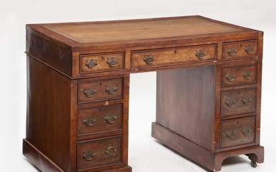 A Victorian walnut pedestal desk