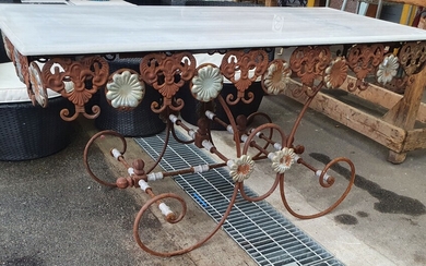 A WROUGHT IRON BASED MARBLE TOP ALFRESCO TABLE