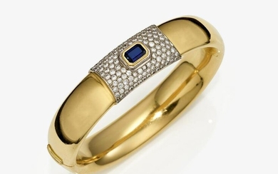 A bangle with a sapphire and brilliant cut diamonds