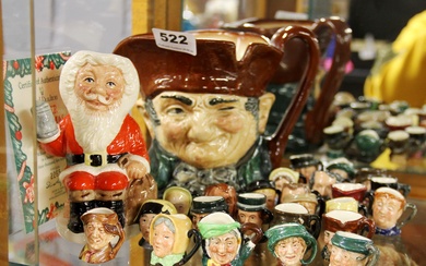 A collection of Royal Doulton miniature character jugs with limited edition 'Father Christmas' and large 'Old Charlie'.