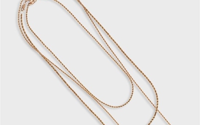 A collection of three fourteen karat gold chain necklaces...