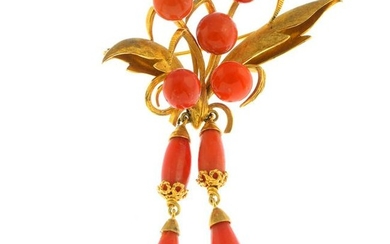 A coral stylised floral spray brooch. Length 10cms.