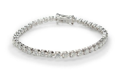A diamond and eighteen karat white gold bracelet