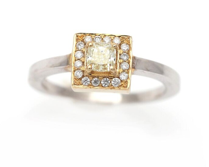 NOT SOLD. A diamond ring set with a Fancy Yellow diamond weighing app. 0.35 ct. encircled by numerous diamonds, mounted in 14k gold and white gold. Size app. 55. – Bruun Rasmussen Auctioneers of Fine Art