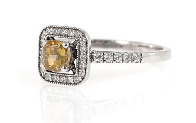 A diamond ring set with a cushion modificed brilliant-cut brown diamond weighing...