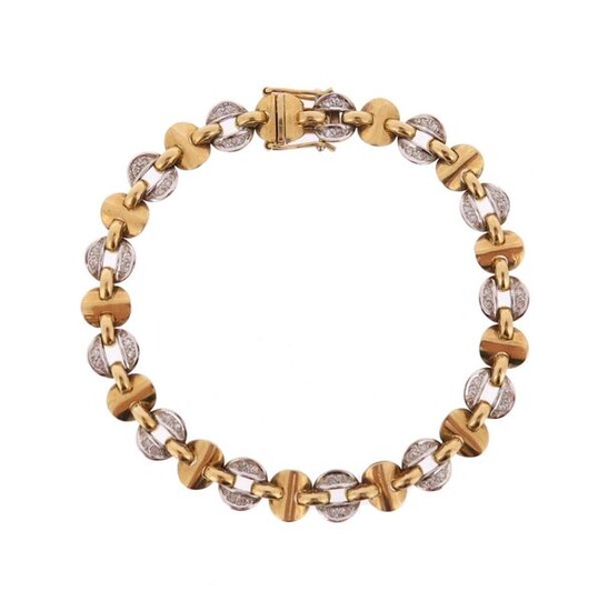 A diamond-set two colour gold bracelet, alternately set with gold...
