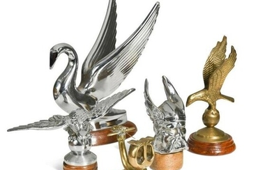 A group of five brass and chrome car mascots