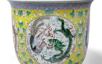 A large Chinese porcelain famille rose 'dragon and phoenix' jardinière, late 19th century, painted with panels enclosing dragons and phoenixes amidst swirling clouds and flaming pearls, with scrolling leafy vines issuing fruit on a yellow ground...