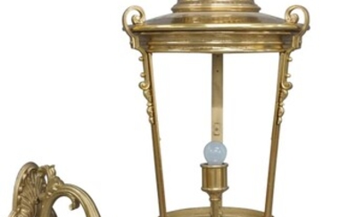A large Victorian style gilt metal wall lantern, with pineapple finial and acanthus leaf scrolling wall mount, 123cm high, 47cm wide, 82cm deep It is the buyer's responsibility to ensure that electrical items are professionally rewired for use