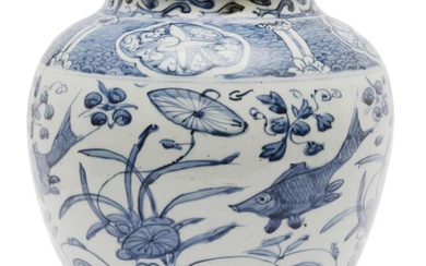 A large blue and white jar with fish pattern