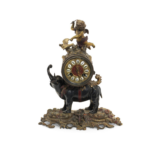 A late 19th century French patinated and gilt bronze figural mantel clock