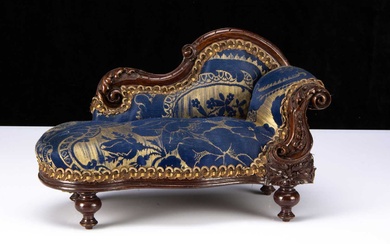 A late 19th century doll’s chaise longue