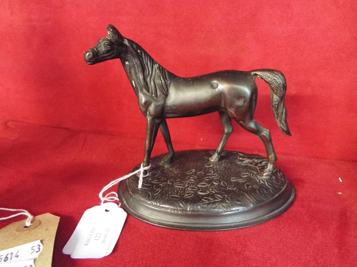 A late 19thC bronze figure of a horse raised on a stylised o...