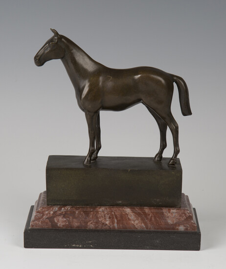 A late 20th century brown patinated cast bronze model of a horse standing four-square, bearing cast
