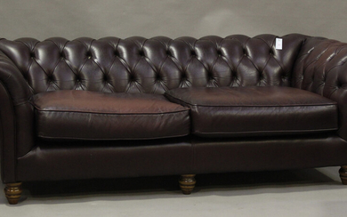 A late 20th century buttoned burgundy leather Chesterfield settee by Thomas Lloyd, height 70cm, widt