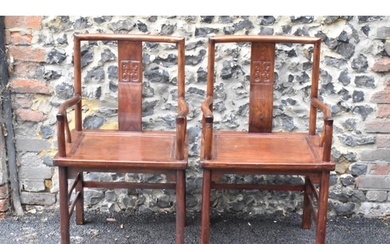 A pair of 20th century Chinese Ming style hardwood armchairs...