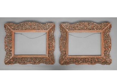 A pair of Chinese pierced, carved and stained wood frames, l...