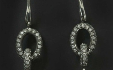 A pair of Continental white gold coral and diamond drop earrings