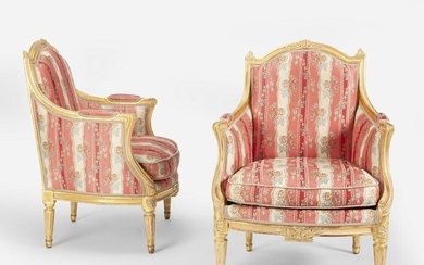 A pair of Louis XVI-style carved giltwood armchairs