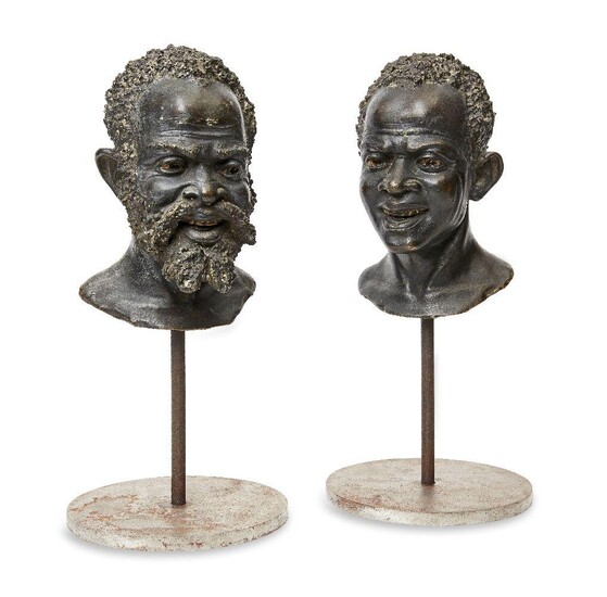 A pair of continental bronze busts of African men, early 20th century, each with cast signature C.Mizza, on modern stands, 35cm high overall (2)