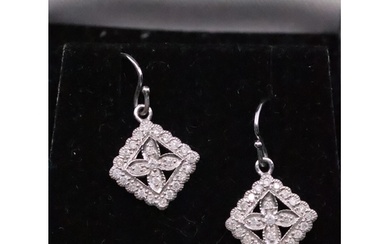 A pair of diamond cluster earrings set in 9ct gold