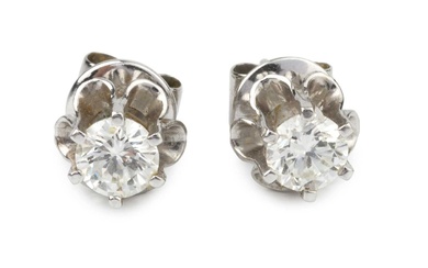 A pair of diamond single stone ear studs, the brilliant...
